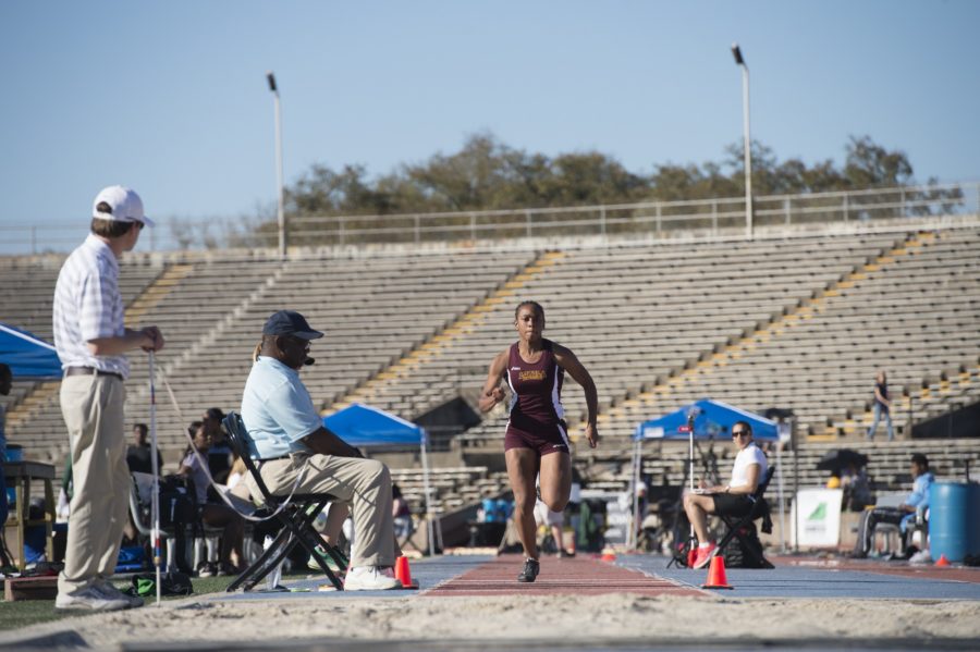 Leah Banks, mass communication sophomore, races toward the sand during the long jump competition at the Tulane Twilight Invitational on March 4, 2016. Banks led Loyola in different categories for the women's team. Photo credit: Courtesy of Loyola Athletics