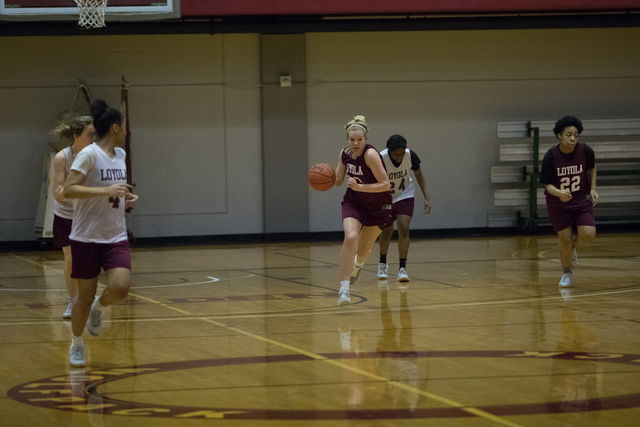 Sophomore+Megan+Worry+takes+the+ball+up+court+during+practice+on+March+10.+The+Wolf+Pack+fell+to+the+Montana+State+University-Northern+Skylights+60-55+on+Thursday.+Photo+credit%3A+Osama+Ayyad