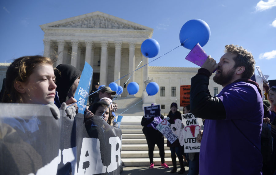 Supporters of legal access to abortion, as well as anti-abortion activists, rally outside the Supreme Court on March 2, 2016, as the Court hears oral arguments in the case of Whole Woman's Health v. Hellerstedt, which deals with access to abortion, in Washington, D.C. (Olivier Douliery/Abaca Press/TNS)