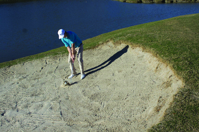 Cameron Condara, freshman Wolf Pack golf team member, hits a bunker shot January 24, 2017, at the Audubon Park New Orleans, Louisiana, for practice. Drew Goff, golf team head coach, said he had a talented team to work with, and he looks forward to helping them fulfilling their potential. Photo credit: Osama Ayyad