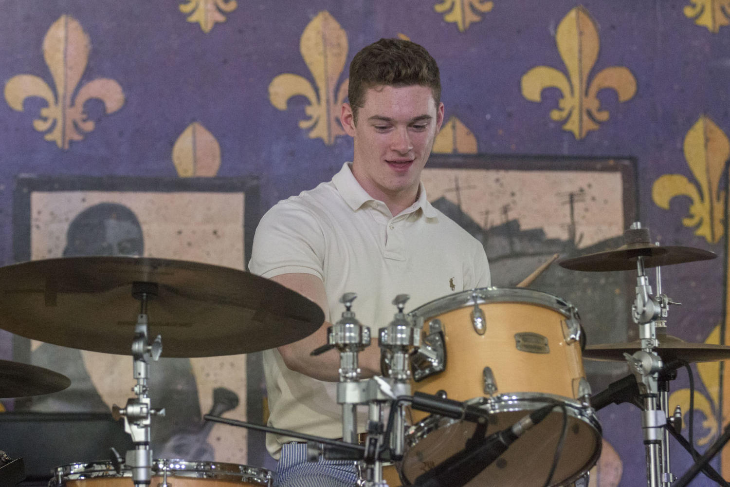 Patrick Kelleher, a music industries senior, plays drums with Don Vappie at the Economy Hall tent during the New Orleans Jazz and Heritage Festival. Skies were clear and weather was mild for the first weekend of the festival.