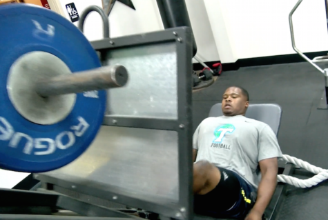 Tanzel Smart, Green Wave defensive tackle, does leg presses in the gym. With the NFL draft beginning on Thursday and going into the weekend, Smart awaits the phone call that will determine his NFL future. 