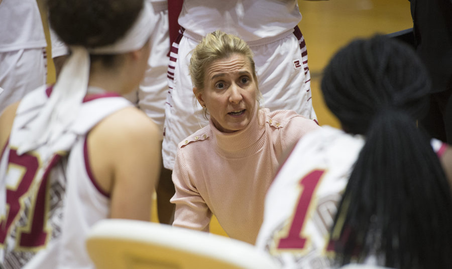 Kellie Kennedy coaches players during a timeout. Kennedy won the Louisiana Sports Writers Association Coach of the Year award on April 7. Photo credit: Courtesy of Loyola Athletics