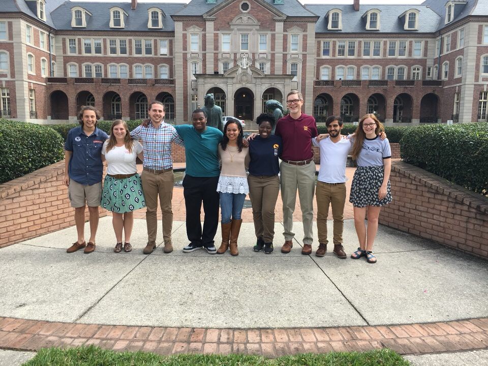 The FaithActs summer theology institute student mentors, along with coordinators Alex Mikulich and Materrinan Zehyoue (third and fourth from right), stand outside Notre Dame Seminary Uptown after their mentor retreat. The student mentors will help participants reflect on their service during the institute. (Courtesy of Materrinan Zehyoue)