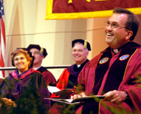 The Rev. Kevin Wildes, S.J., listens to the encouragement of several speakers at his inauguration in Roussel Hall on Oct. 15, 2004. The inauguration included a Mass, ceremony, reception and Collage concert at the end of the night. Photo credit: The Maroon