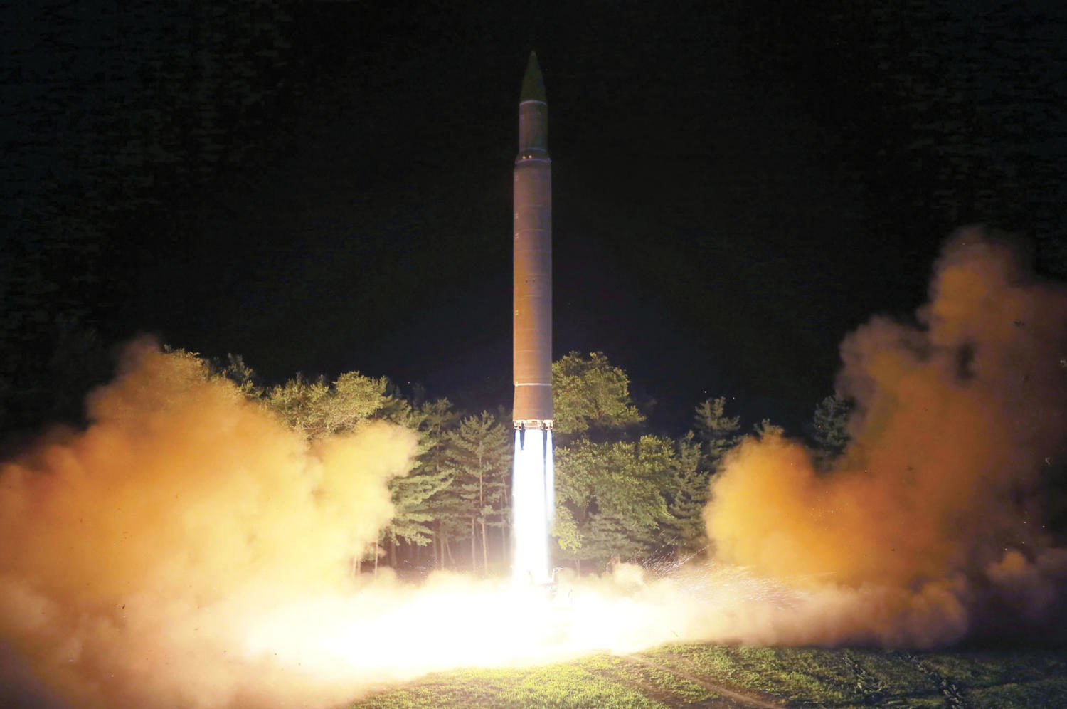 FILE - This July 28, 2017, file photo distributed by the North Korean government shows what was said to be the launch of a Hwasong-14 intercontinental ballistic missile at an undisclosed location in North Korea. America’s annual joint military exercises with South Korea always frustrate North Korea. Some experts say North Korea is mainly focused on the bigger picture of testing its bargaining power against the United States with its new long-range missiles and likely has no interest in letting things get too tense during the drills. (Korean Central News Agency/Korea News Service via AP, File)