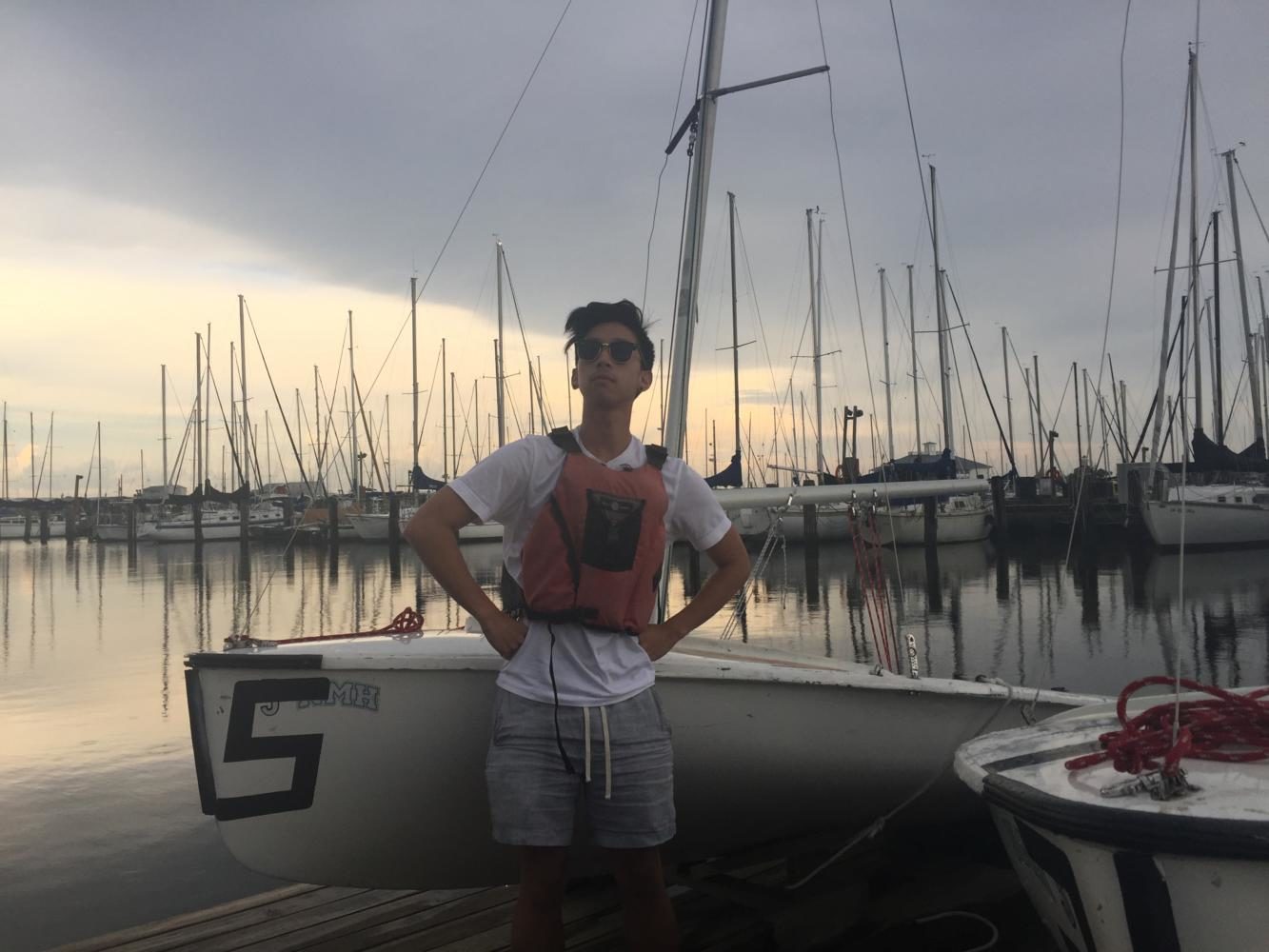 Sports editor JC Canicosa stands in a satirically heroic pose, ready to take on what Lake Pontchartrain throws at him. Photo credit: Sophie Duffy