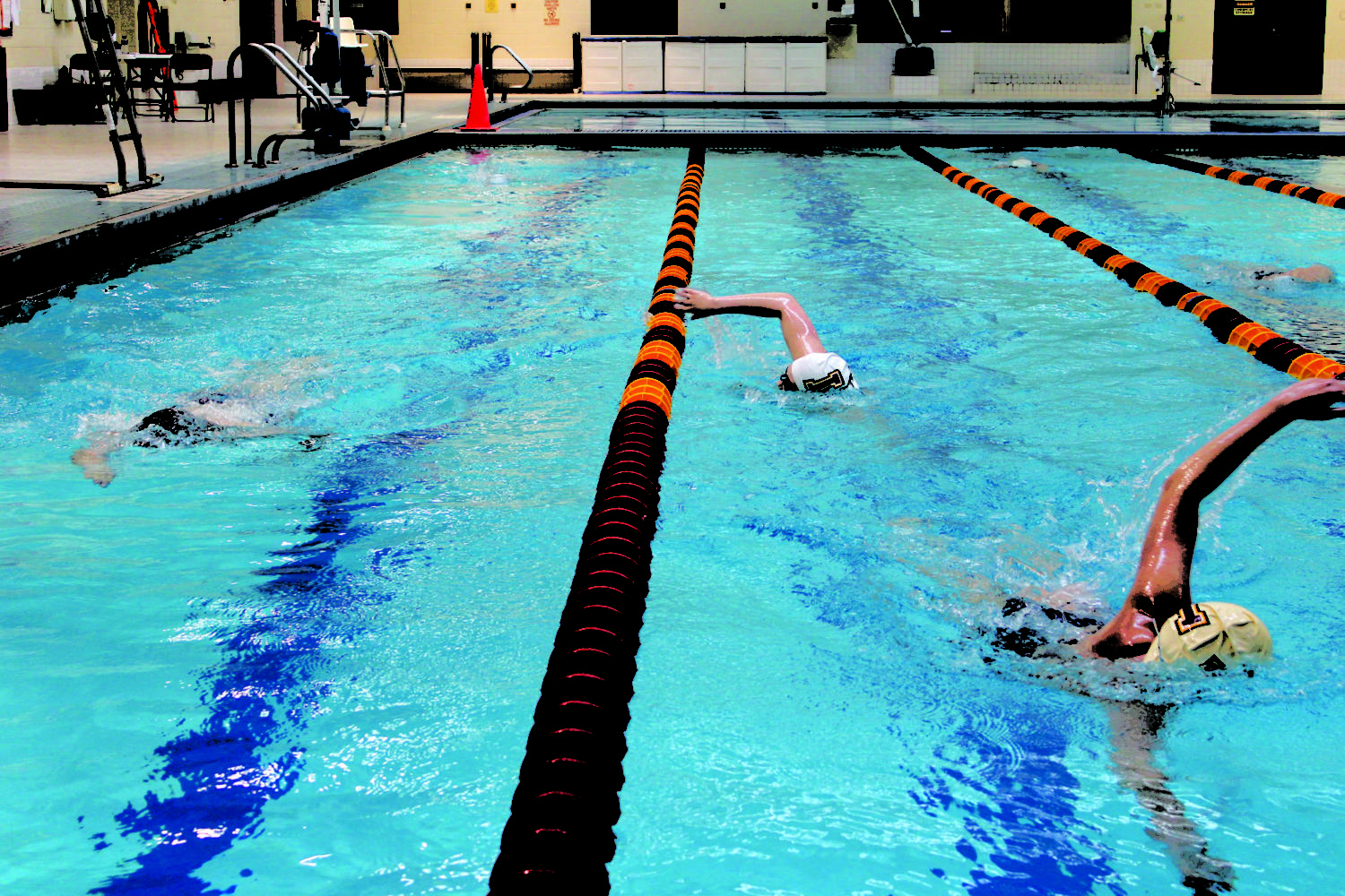 The swimmers practice their strokes in the sports complex pool. The Wolf Pack is eager to improve and grow with the new additions to the squad.