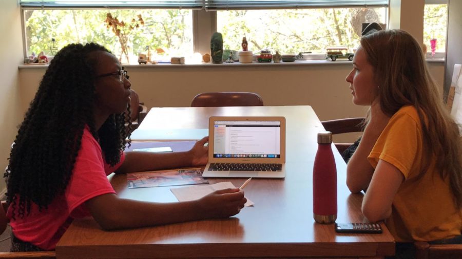 Rodriana Edwards, right, shows Nicole Bouchie, environmental science sophomore,
different study abroad programs for Japan. Loyola’s Center for International Education
provides peer advisors to aid students who are interested in traveling while in college. Photo credit: Chasity Pugh