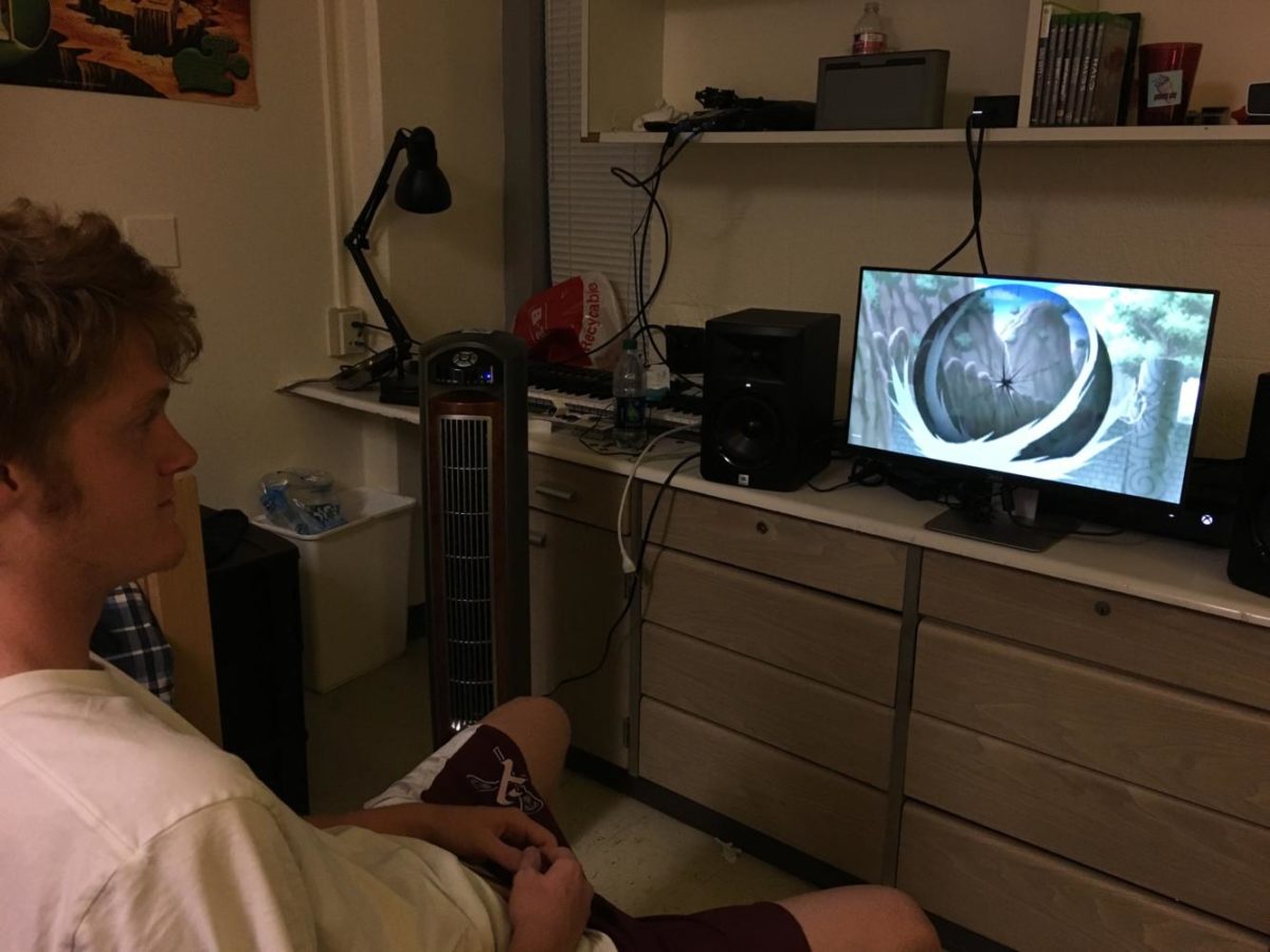 Ian Tellechea, a music industry student, watches Naruto in his dorm room. Photo credit: Kaylie Saidin