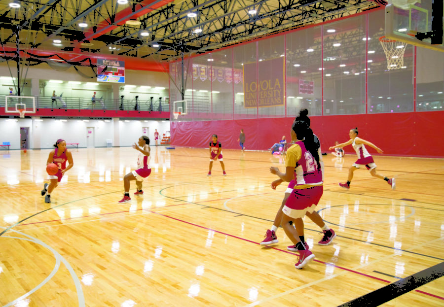 The womens basketball team practices at The Den. The team hopes to progress on a successful season last year. Photo credit: Julia Santos