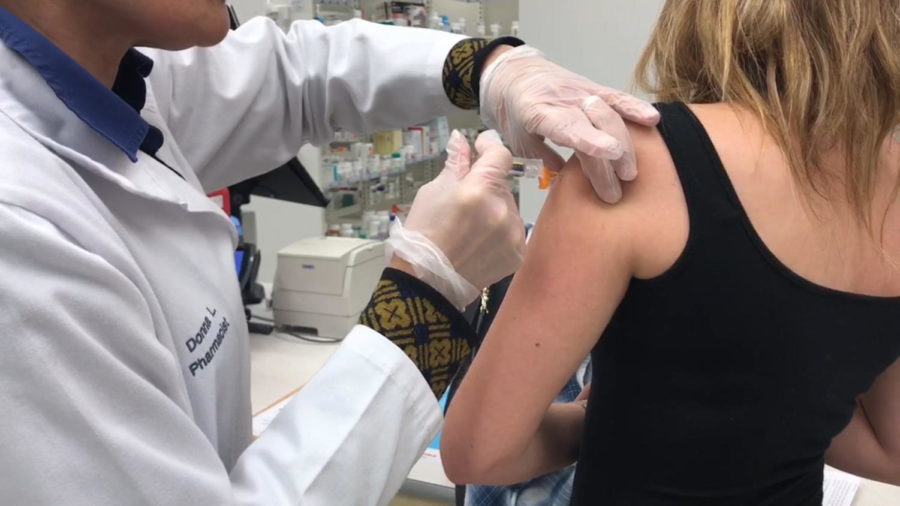 Pharmacist Donna L. administers a flu shot Jan. 18, 2018, at a Walgreens in New Orleans. Doctors and pharmacist can give the flu shot. SOFIA SAMAYOA/The Maroon.