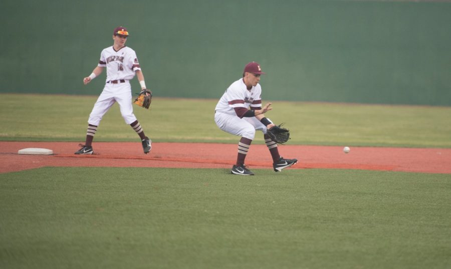 Business freshman Zach Cook (18) and business sophomore Brandon Wilson Jr. (23) stop an offensive play during a game against Louisiana College Feb. 17, 2018, at Signette Field in Westwego, Lousiana. Loyola lost their doubleheader versus the Wildcats at home. LOYOLA NEW ORLEANS ATHLETICS/Courtesy Photo credit: Loyola New Orleans Athletics