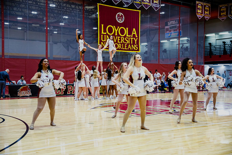 The Loyola dance and cheer teams perform a halftime routine at the University Sports Complex Jan. 20, 2018, during Loyolas womens basketball game against Faulkner University. The dance team is gearing for a dance team championship Feb. 3, in Mobile, Alabama. Photo credit: Julia Santos