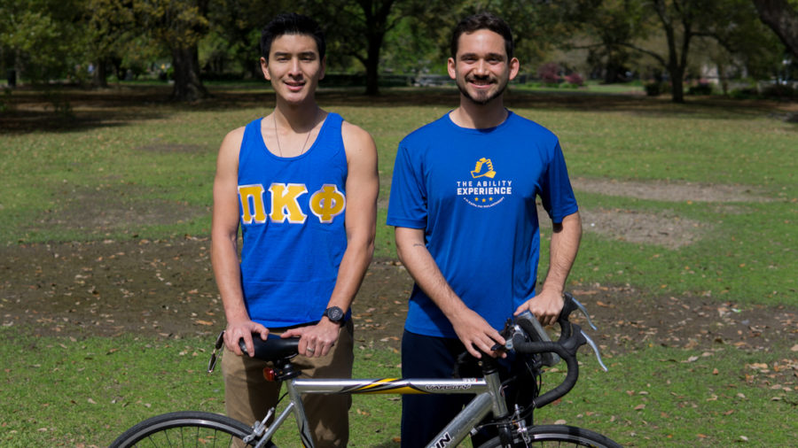 Jared Chan, left, and Bryant Istre, right, pose together with a bicycle, dressed to represent their fraternity, Pi Kappa Phi, and the nonprofit The Ability Experience.  They will be cycling across the State of Florida this summer with other members of the Fraternity to raise money and awareness for the nonprofit. Photo credit: Jacob Meyer