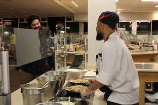 A Sodexo worker serves food to a student in the Orleans Room. Loyola has partnered up with Sodexo and initiated a food recovery program to stop the food waste in the Orleans Room. Photo credit: Jacob Schmitt