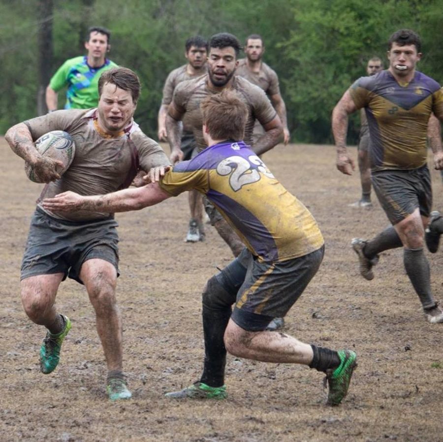 Sean Brennan, mass communication senior, rushing through a Tennessee Tech University player at the National Small College Rugby Organization on March 27, 2018. The Loyola rugby team fell to Tennessee Tech University in the championship round. Photo credit: Seán Brennan