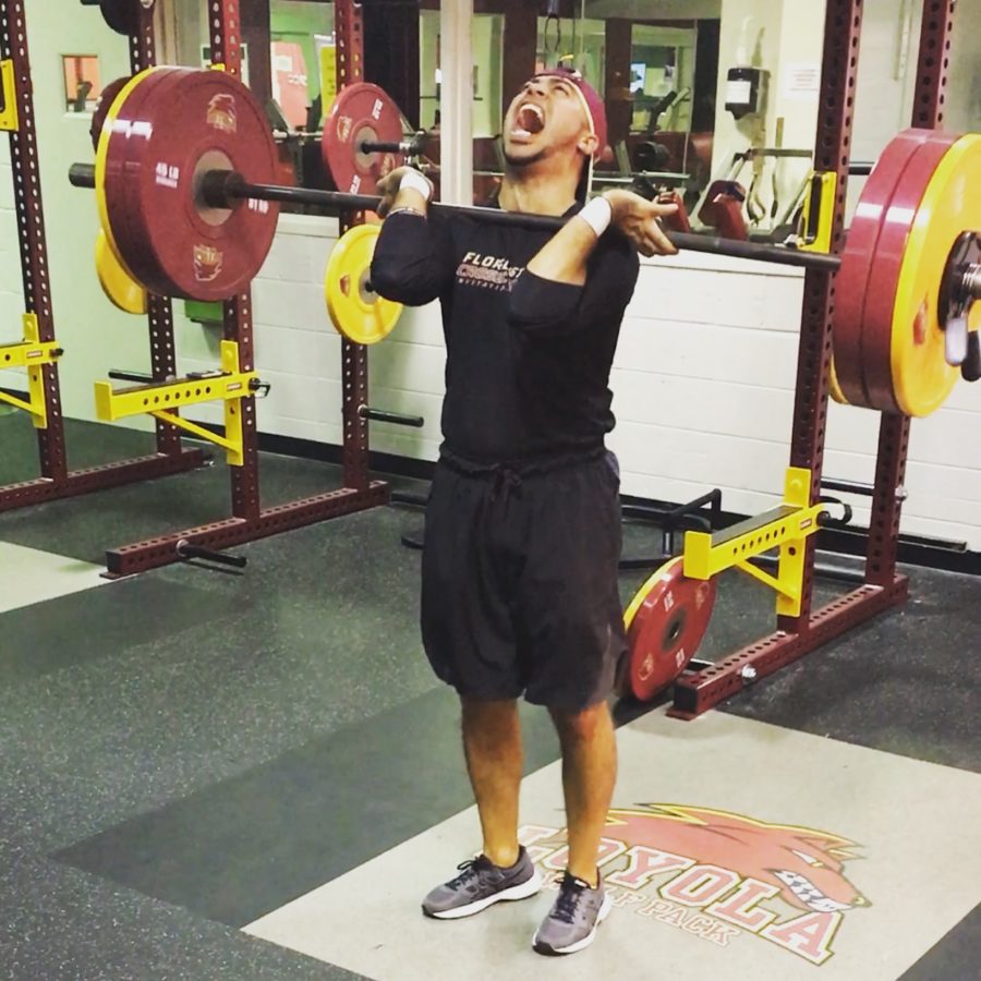 Track and field head coach Nick Dodson lifts his personal best 260 pounds in the power clean this year. In his second year as coach, Dodson has made it his goal to workout with his athletes and foster a family culture. NICK DODSON/Courtesy.