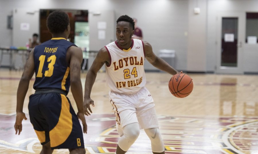 TreVon Jasmine (24), computer science junior, posting up a player from Blue Mountain College at The Den Feb. 24 2018. The Loyola mens basketball team advance to the conference round of the Southern States Athletic Conference Championship. Photo credit: Loyola University Athletics