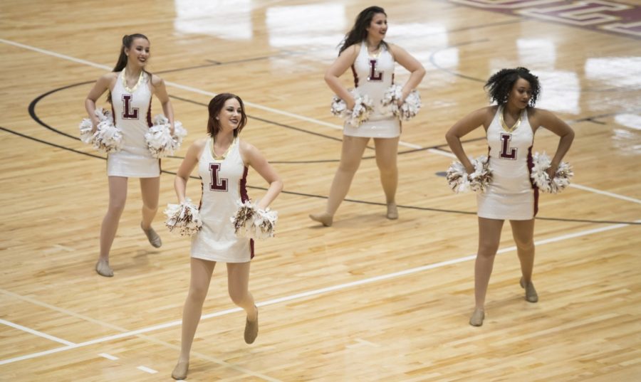 The Loyola dance team performing during halftime at a Loyola basketball game. The dace team finished 11th at the National Association of Intercollegiate Athletics National Championship. Photo credit: Loyola New Orleans Athletics