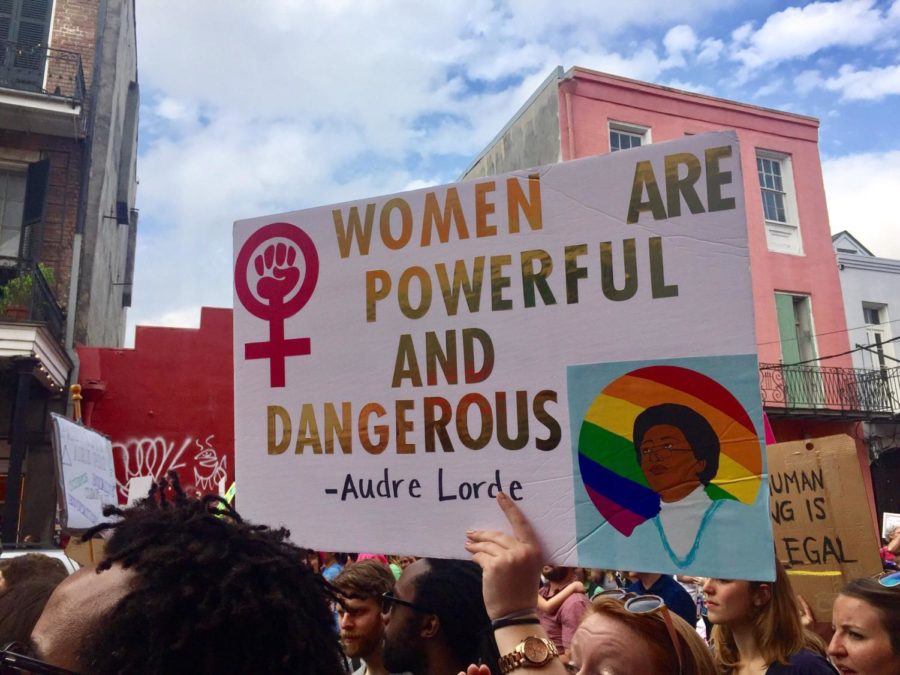 A protester holds up a sign at the New Orleans Womens March in January 2017. Courtesy / Camille Didelot