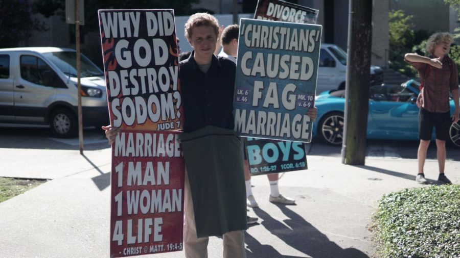 A Westboro Baptist Church member displaying his signs on Loyolas campus. Photo credit: Jacob Meyer