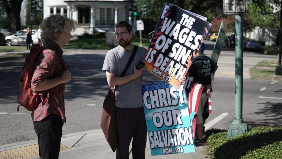 A Loyola student confronts a Westboro Baptist Church member on June 28, 2018. Photo credit: Jacob Meyer