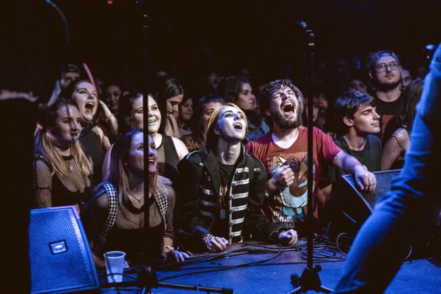 Emo Night goers crowd around the stage. Emo Night was unlike most concerts because no barricades separated the musicians and the audience. Photo credit: Julia Santos