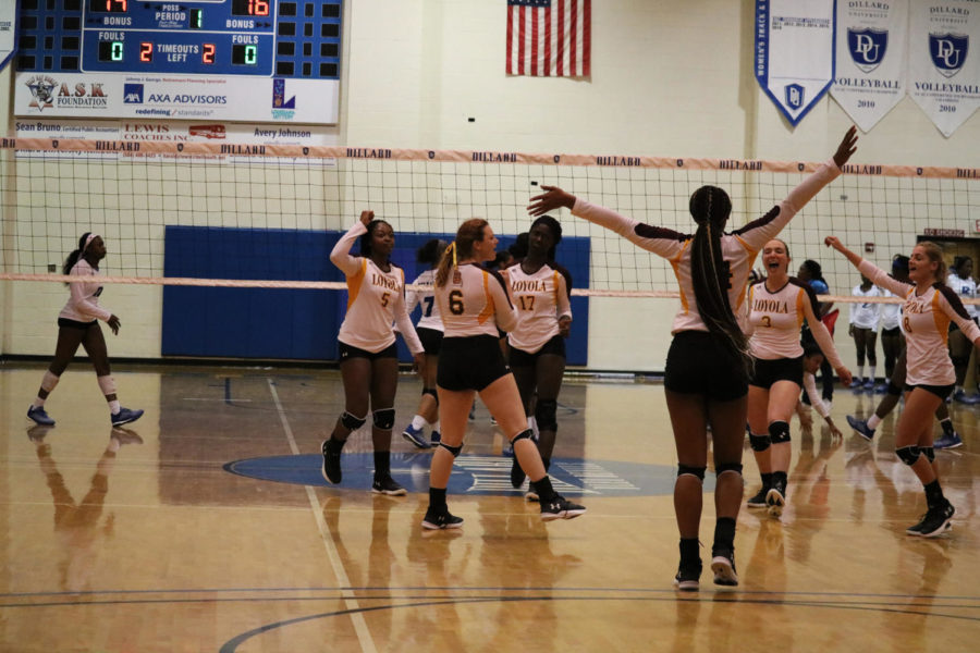 Mass communication junior Tyler Beckham celebrates with the team. The team would go on to beat Dillard University 3-1 and Beckham would finish with eight kills that match. Photo credit: Sidney Ovrom