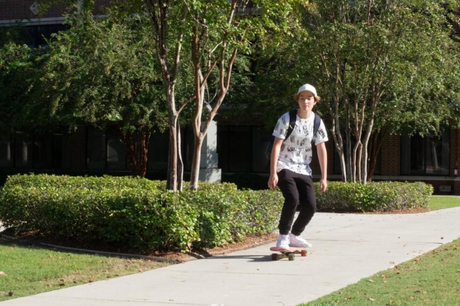 Loyola sophomore Alli Krusche-Bruck rides her skateboard to get from place to place faster. Photo credit: Samuel Kahn