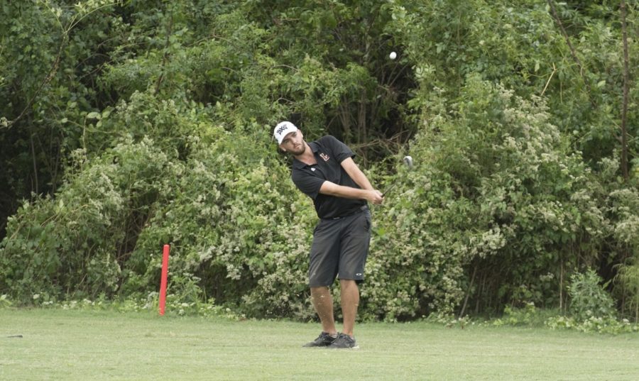 Mass communication senior Ryan Hicks takes a shot from the fairway. Hicks finished +4 in the two days of competition at the Savannah College of Arts and Design Atlanta Fall Invitational. Photo credit: Loyola New Orleans Athletics