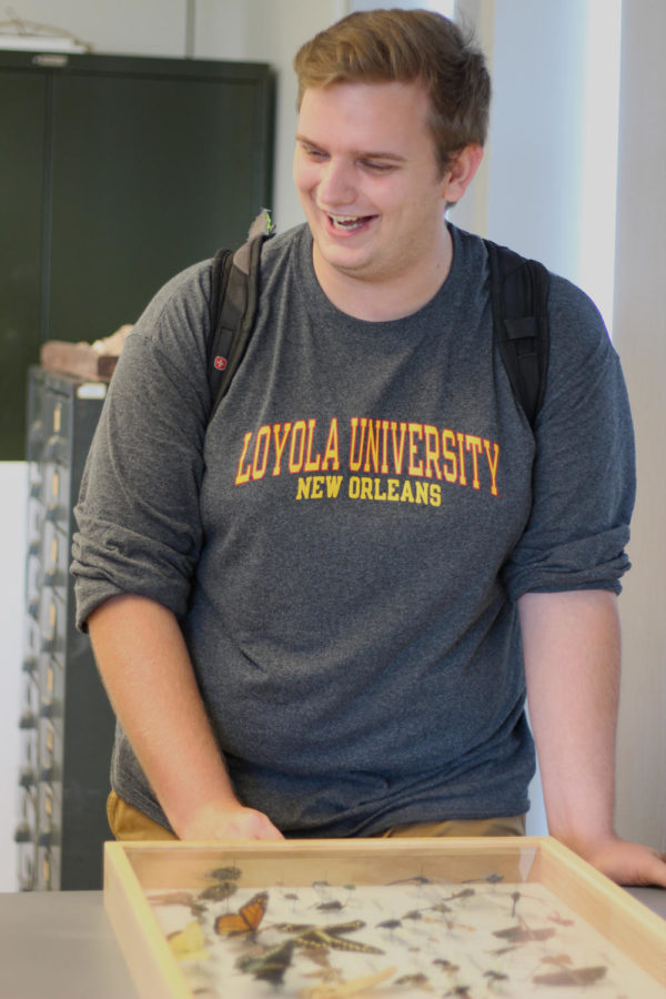 A cheerful Andrew Harper, environmental science senior, smiles as he describes his upcoming talk. Harpers thesis was driven by his interest in the interactions between dragonflies and an urban environment. Photo credit: Cristian Orellana