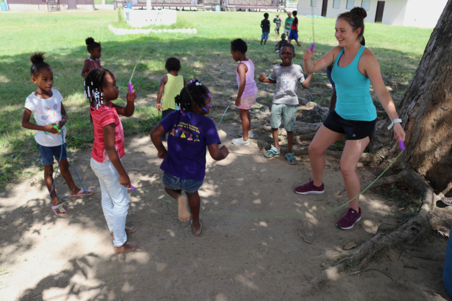 Public relations junior Paige Carter twirls the jump rope around for the children in Belize. Carter was one of 12 Loyola athletes who went on the trip. Photo credit: Rev. Ted Dziak S.J.