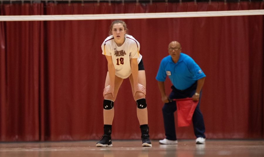 Psychology senior Malea Howie stands out the ready. Howie finished with 22 kills in the two games against Florida College and Florida National University. Photo credit: Loyola New Orleans Athletics