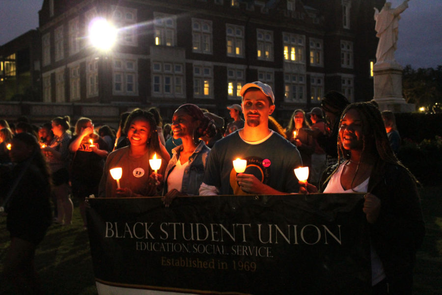 Students from campus organizations gathered with signs and candles to show their support for sexual assault victims. The event has been going on for the past 27 years. Photo credit: Hannah Renton