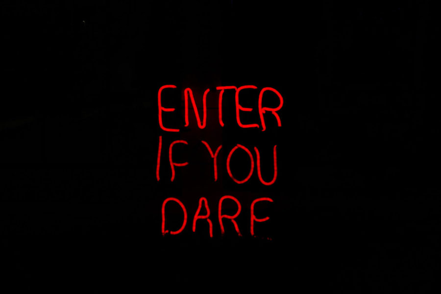 The+Enter+if+You+Dare+sign+sat+outside+of+a+palm+reading+tent+at+Scout+Island+Scream+Park.+The+sign+set+the+tone+for+park%2C+as+only+those+who+are+brave+should+risk+entering+in+the+attractions.+Photo+credit%3A+Erin+Haynes