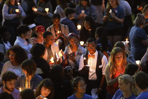 Students gather in front of Marquette Hall for Take Back the Night on October 24. Students and community members gather to advocate for sexual assault victims. Photo credit: Cristian Orellana