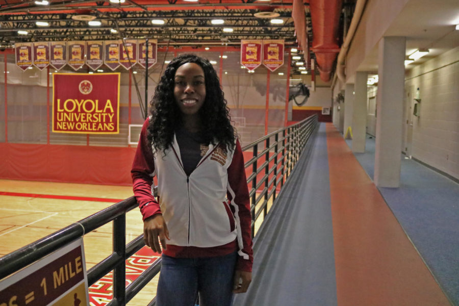 Amani Bryant poses in the University Sports Complex. Bryant was hired Sept. 24 as an assisstant coach for both the cross country and the track and field programs. Photo credit: Sidney Ovrom