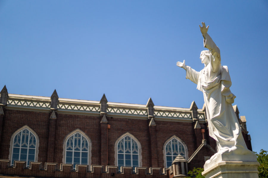 Statue of Jesus stands in front of Marquette Hall on St. Charles Ave. Photo credit: Jacob Meyer