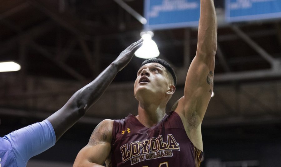 Business senior Sammis Reyes puts up a shot. Reyes led the team with 8 rebounds and 6 assists against Xavier University. Photo credit: Loyola New Orleans Athletics
