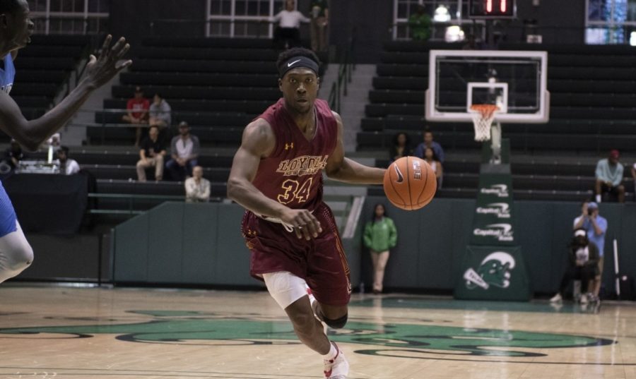 Business+sophomore+Terry+Smith+Jr.+%2834%29+drives+to+the+basket+off+of+a+fast+break.+Photo+credit%3A+Loyola+New+Orleans+Athletics