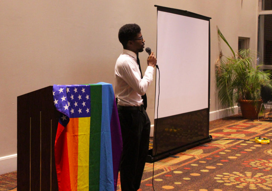 Barry D. McGuire performs a spoken word poem about the difficulties of being a black man in the LGBTQ community at Loyola’s World AIDS Day Cocktail Party on Dec. 1.  The event was hosted by Delta Sigma Theta and Loyola’s newly formed LGBTQ organization, Plus+. Photo credit: Hannah Renton