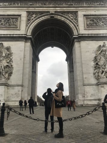 Erin Hayes, pictured above, poses below Arc de Triomphe in Paris, France.