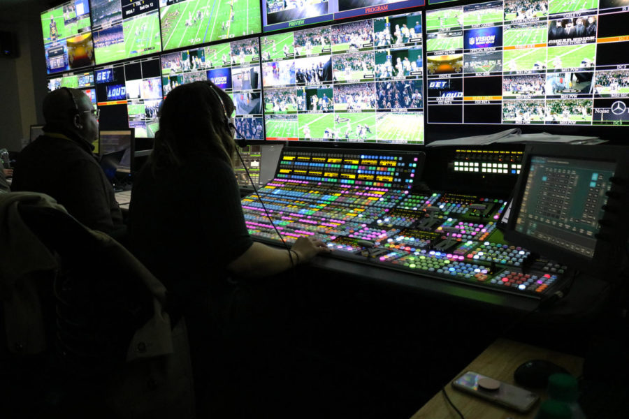 The director of the New Orleans Saints in-stadium production sits in front of her switcher board. Photo credit: Albert Dupont