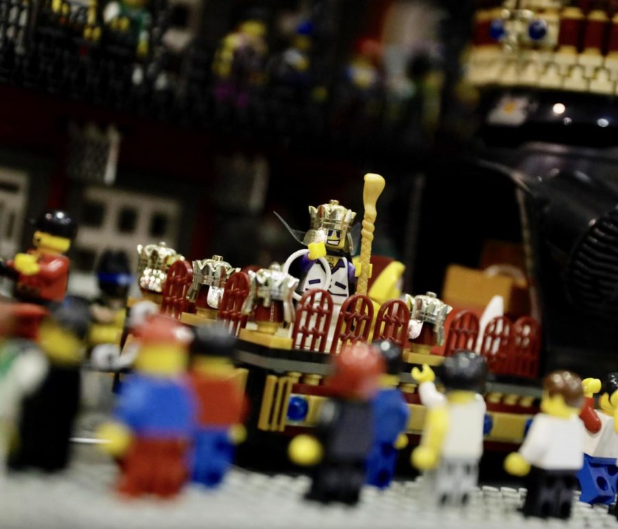 The king of the LEGO Mardi Gras set stands in his float.