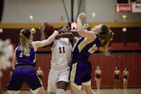 International business junior Kaila Anthony (11) receives a foul from a Bethel player. Anthony scored a team-high 27 points as well as blocking three shots and grabbing three steals. Photo credit: Michael Bauer