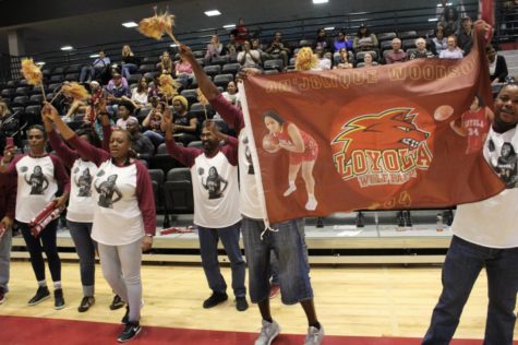 The family of biology senior AnJolique Woodson came prepared to cheer her on for Senior Night. Photo credit: RoshaE Gibson