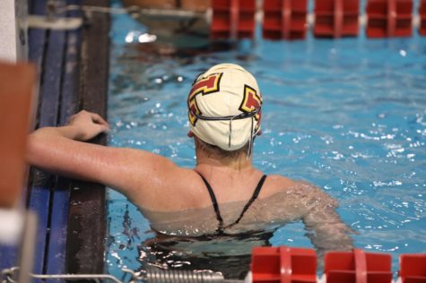A Loyola women's swimmer looks at her total time after her relay race at a home meet on Jan. 9, 2019. Loyola's swim teams had top-10 finishes for the second year in a row. Photo credit: Andres Fuentes