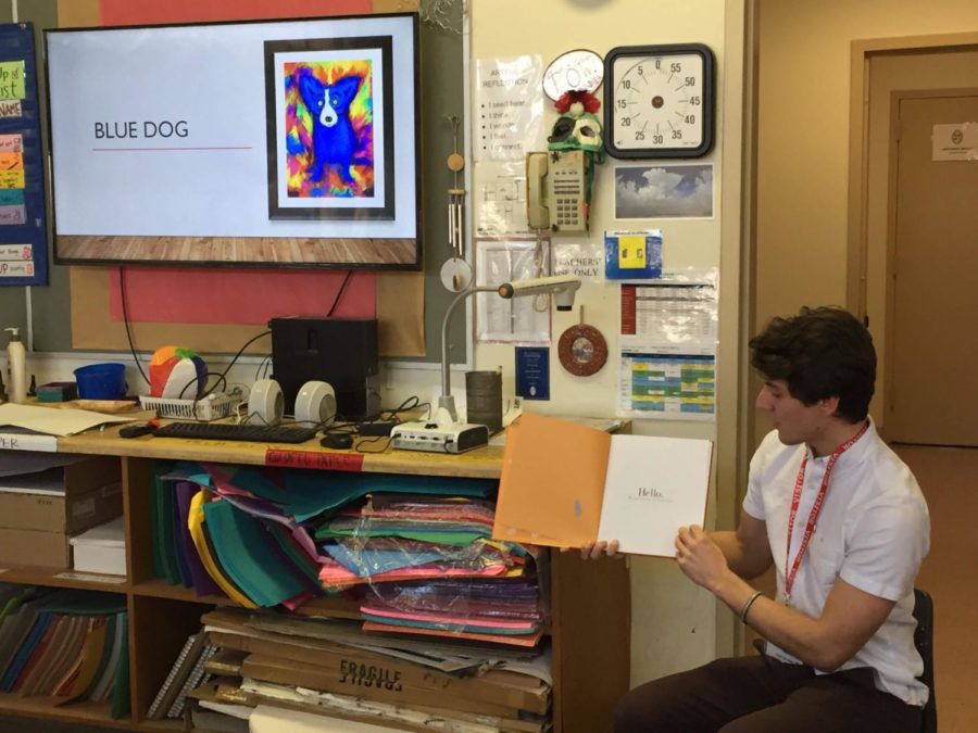 Robert Prasso, new member of Pi Kappa Phi fraternity, reads childrens book to students at St. George’s Episcopal Elementary School. Courtesy of Pamela Skehan.
