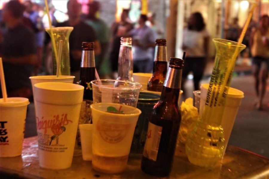 Bottles and cans line a table on Bourbon Street. The street is a popular destination for students and tourists. Photo credit: Andres Fuentes